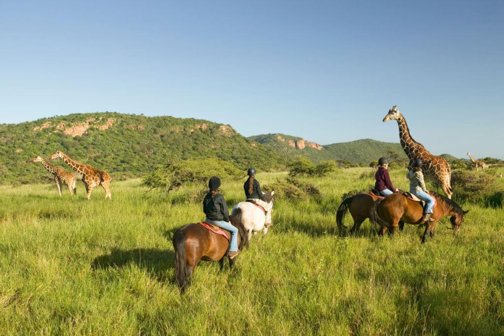 Tourists on horse back safari in Kenya